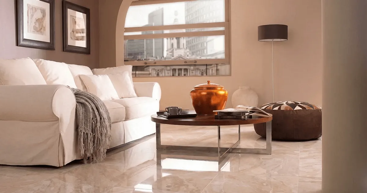 Modern living room with professionally installed marble flooring, a beige sofa, coffee table in Bloomington, IN
