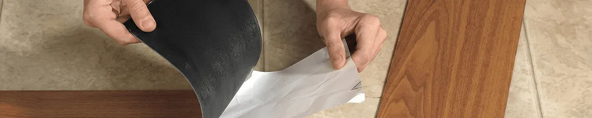 A professional installing vinyl flooring in Bloomington, IN